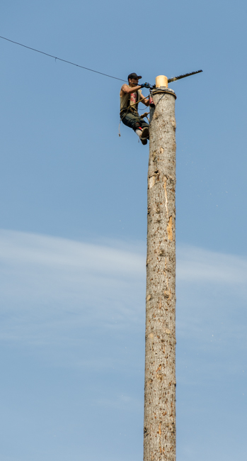 This is the most difficult event. You must climb all the way to the top and then cut the top off the log at the top. Very scary!