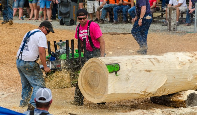 A car engine is attached to a chain saw!