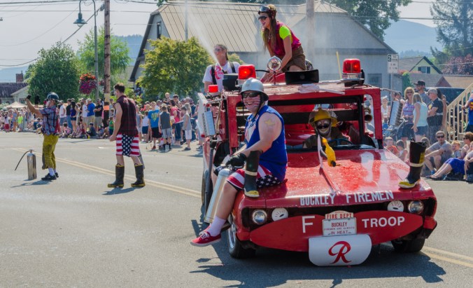 It was a hot day, so everyone loved it when the clowns sprayed them with water.