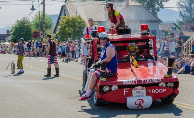It was a hot day, so everyone loved it when the clowns sprayed them with water.