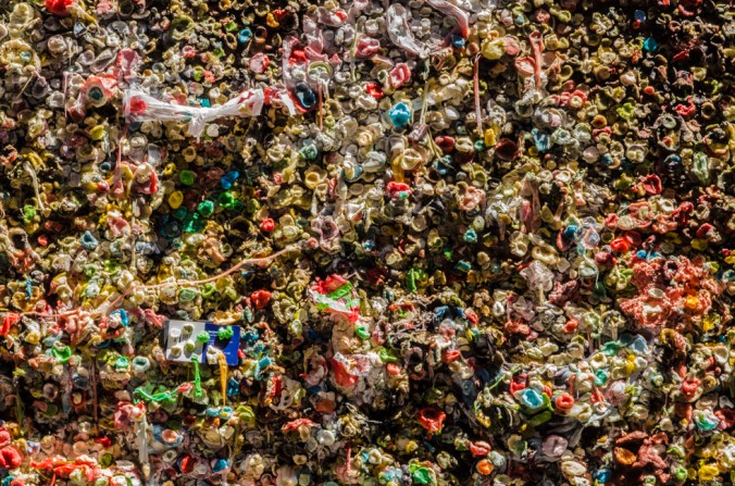 People place their chewed gum on the brick wall.