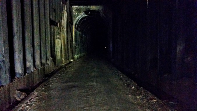 Inside the St. Paul Pass Tunnel that is 1.7 miles long, completely dark inside, and quite chilly in temperature.