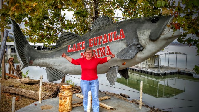 Charlene shows the length of the fish she caught!