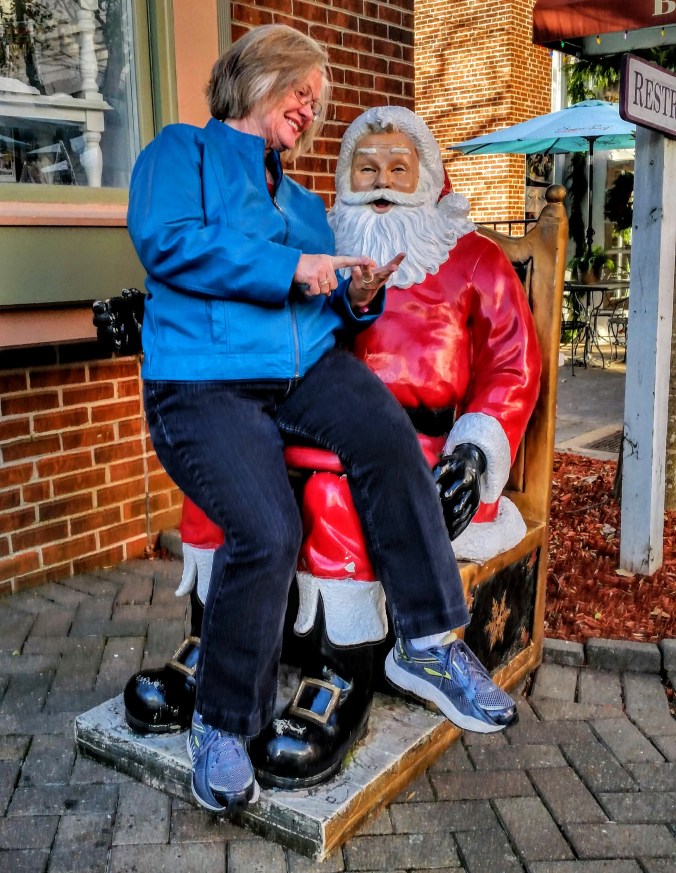 Charlene counting gifts with Santa